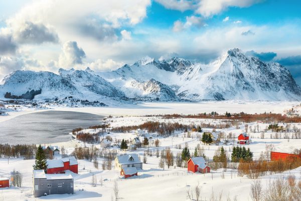 Breathtaking winter scenery over Bostad village and Torvdalshalsen lake seen from Torvdalshalsen. Fantactic mountain ridge. .  Location: Bostad, Vestvagoy, Lofotens, Norway